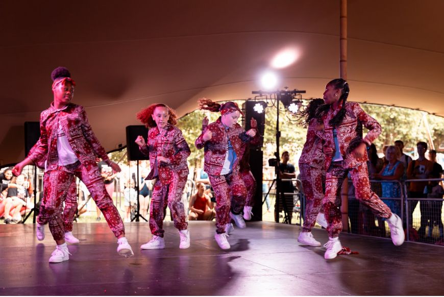 4 girls dancing on a stage